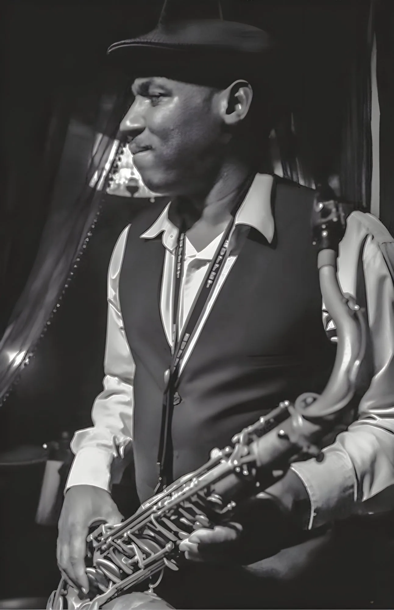 Portrait of Richie Garrison with saxophone
