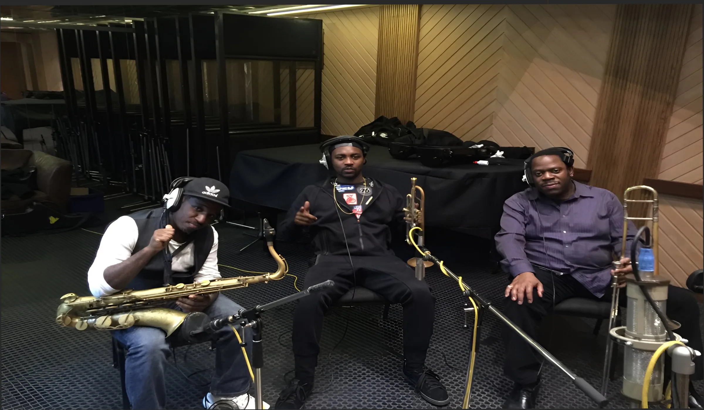 Richie Garrison in studio with horn section